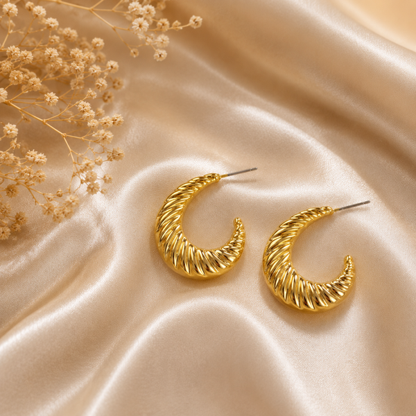 Gold crescent-shaped hoop earrings